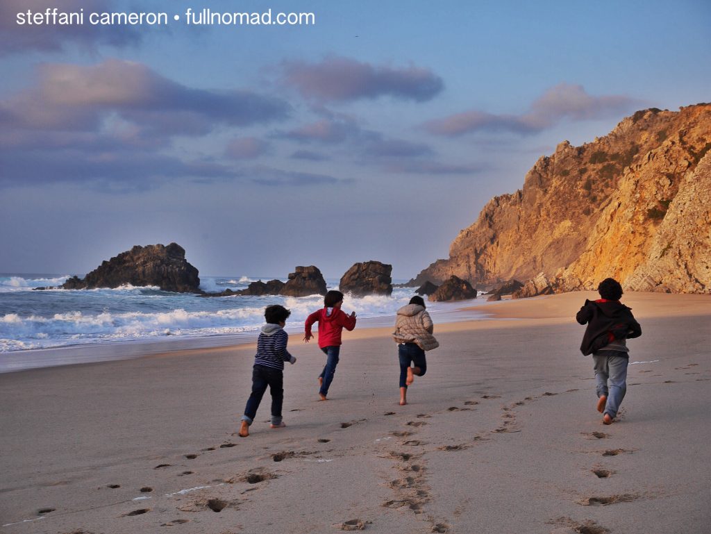 boys running on a beach